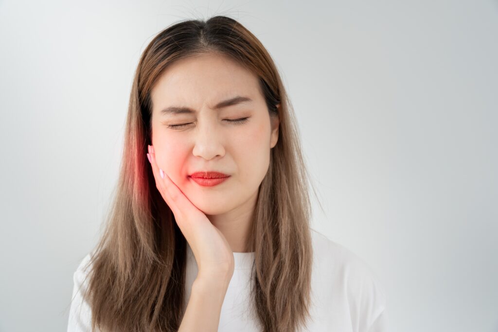 Patient experiencing pain due to old teeth filling