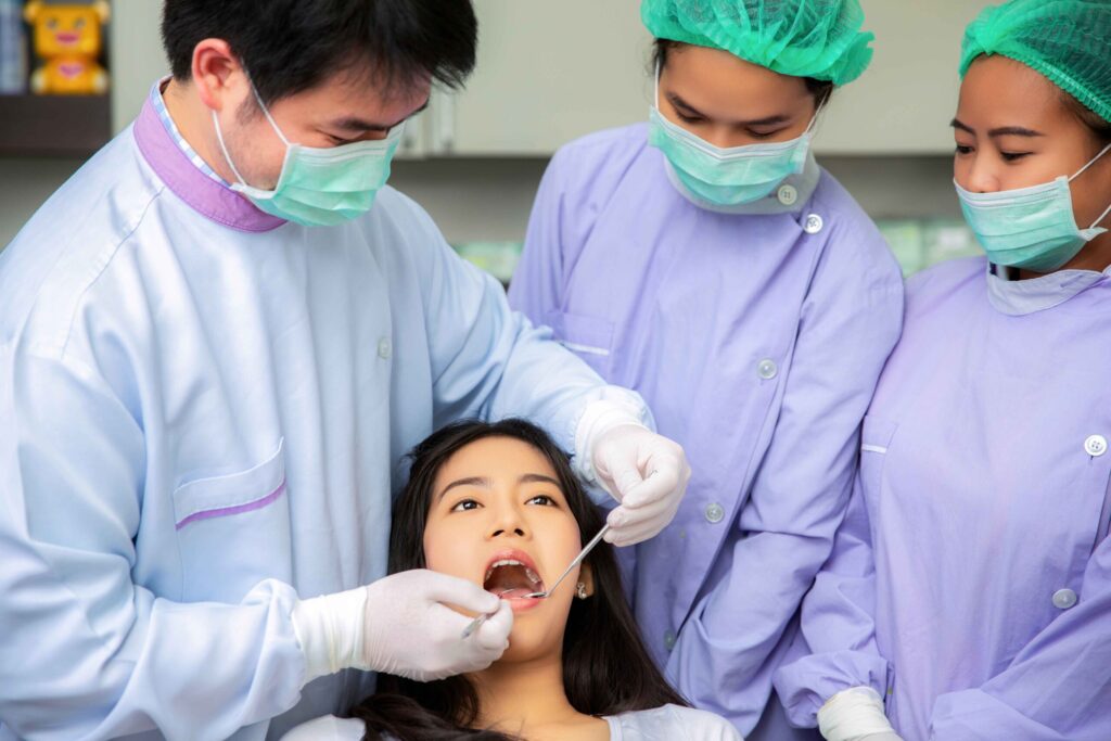 A lady gets her teeth checked at a bukit timah dentist
