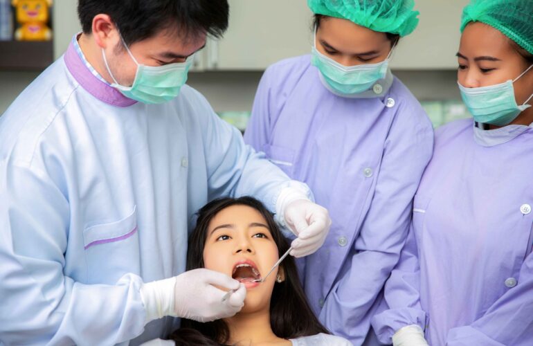 A lady gets her teeth checked at a bukit timah dentist