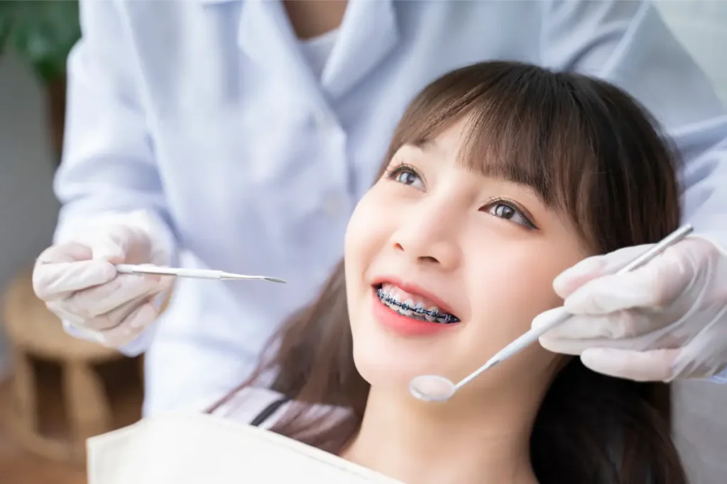 A young, Asian lady at the dentist getting orthodontics in Singapore