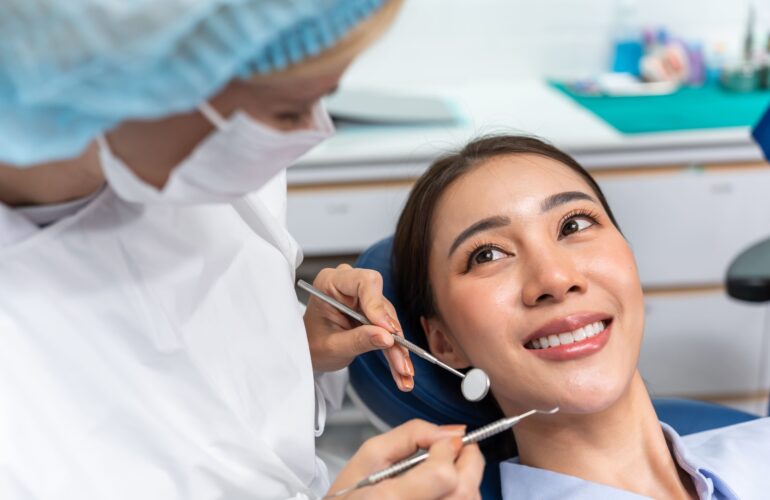 a woman having a dental check up before her dental prosthesis procedure in Singapore